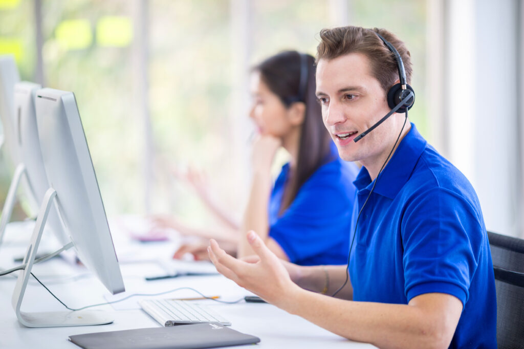 operator men agent with headsets working in telemarketing